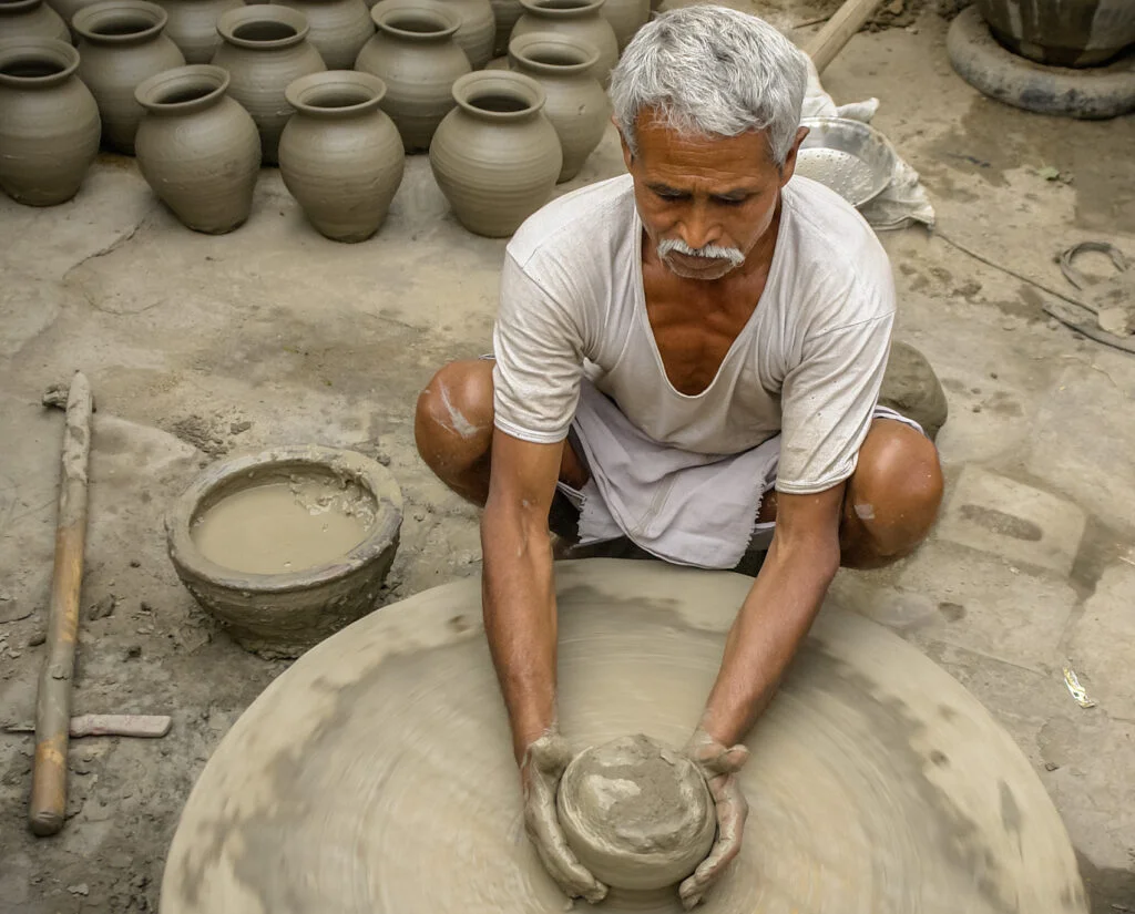 PM Vishwakarma Yojana - potter making clay pots, one of 18 covered trades